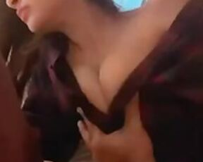 Playing with her tits